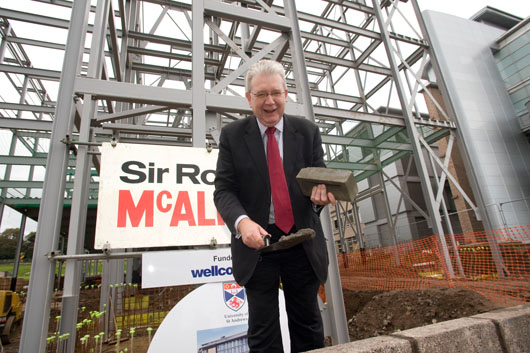 Education Secretary Mike Russell laying one of the first bricks for the new Biomedical Sciences Research Complex