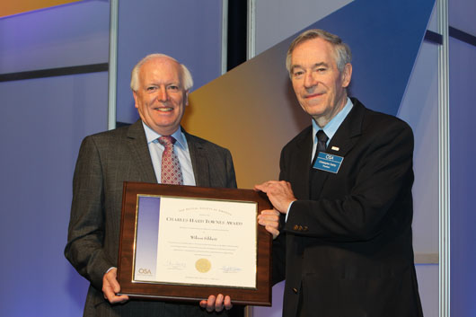Professor Sibbett receiving the Charles Hard Townes Award from Professor Dainty, the President of the Optical Society of America.