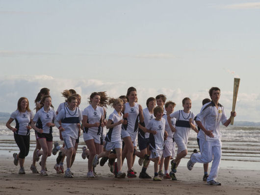 Local children on the West Sands with the Olympic torch