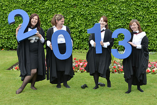 New graduates celebrate receiving their degrees at a ceremony on Tuesday morning.