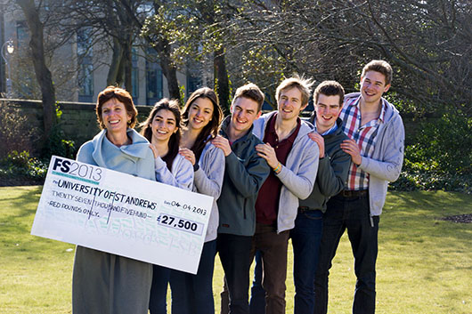 Student organisers and models visiting Principal and Vice-Chancellor Professor Louise Richardson to hand over the record-breaking cheque