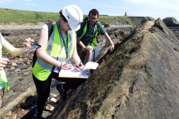 GeoBus Sean with senior pupils on an Earth science field camp exploring the volcanic history of the Fife coastline.