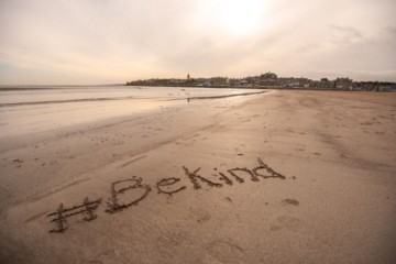 #BeKind written in sand on the West Sands beach