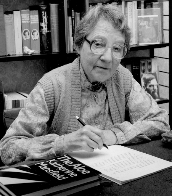 A black and white photograph of Brownlee Jean Kirkpatrick writing