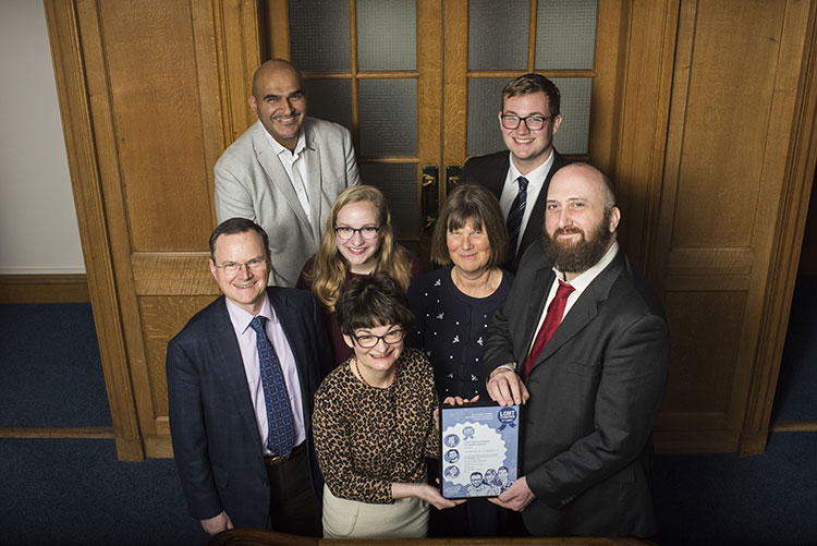 Principal Sally Mapstone and other members of staff accept the LGBT Youth Scotland charter award