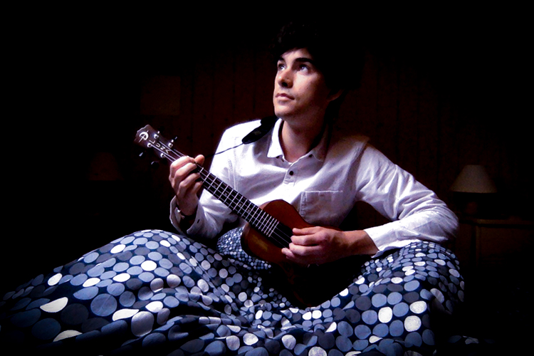 Tom Conti-Leslie playing a ukelele