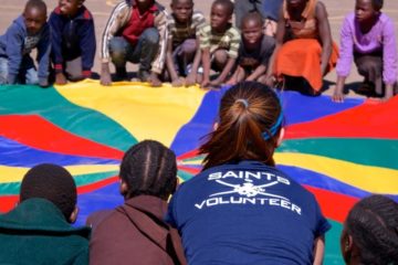 Zambian children playing with a parachute