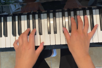 Fingers playing a piano