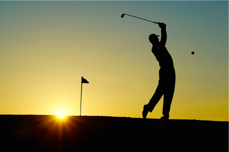 silhouette of golfer taking a swing