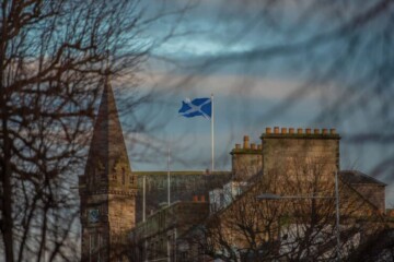 Scottish Saltire flag flying over a church steeple