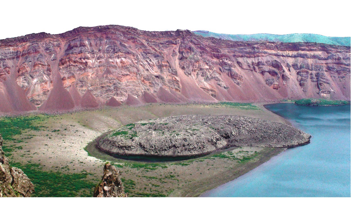 The mystery eruption occurred at Zavaritskii volcano (Simushir Island, Kurils). The explosion generated a 3-km wide caldera revealing spectacular red, black and white layers made up of past eruptive deposits. (Image credit: Oleg Dirksen)