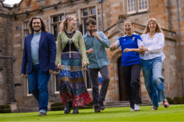smiling students in the quad