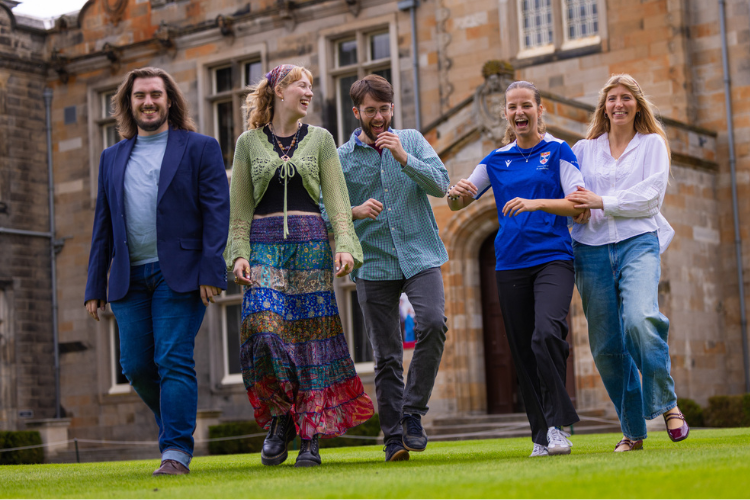 smiling students in the quad