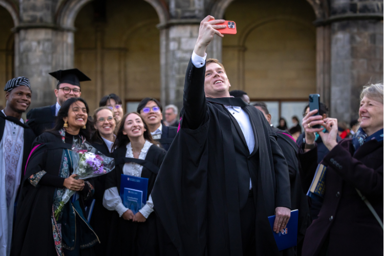 Smiling graduates take a selfie